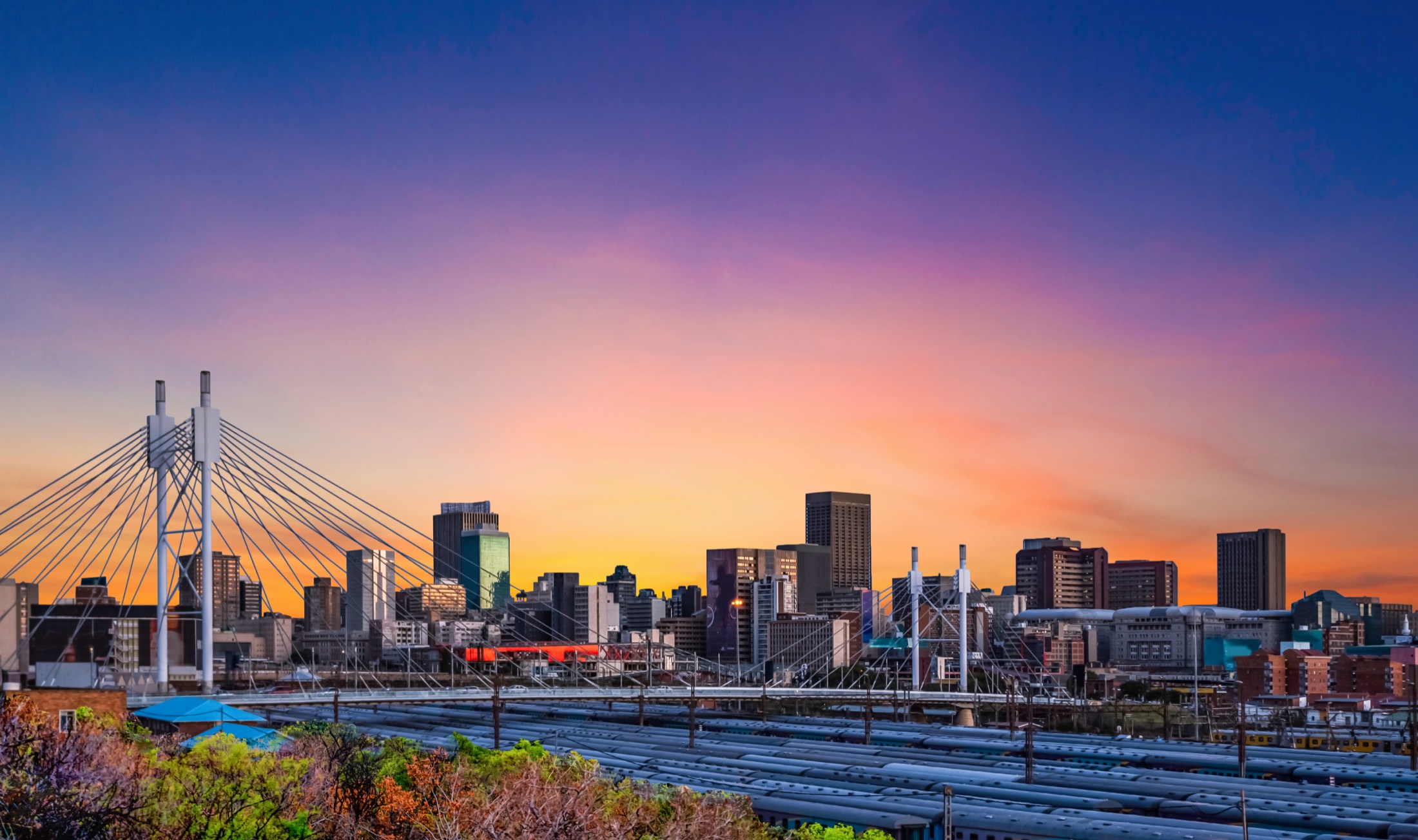 Nelson Mandela Bridge and the Johannesburg skyline at sunset
